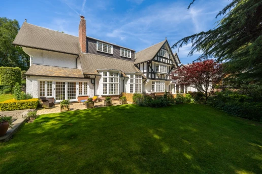 Rear elevation and landscaped lawn at Fieldhead, Prestbury