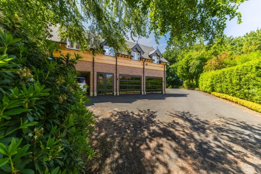 Timber-framed entrance elevation and driveway at Fieldhead, Prestbury