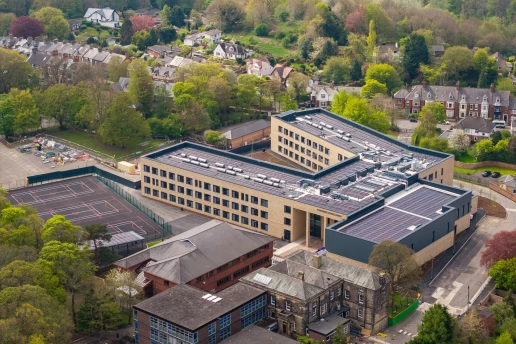 Aerial view of the completed school campus and roofscape
