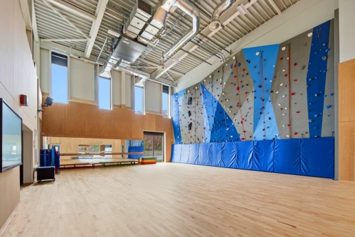 Sports hall with integrated climbing wall
